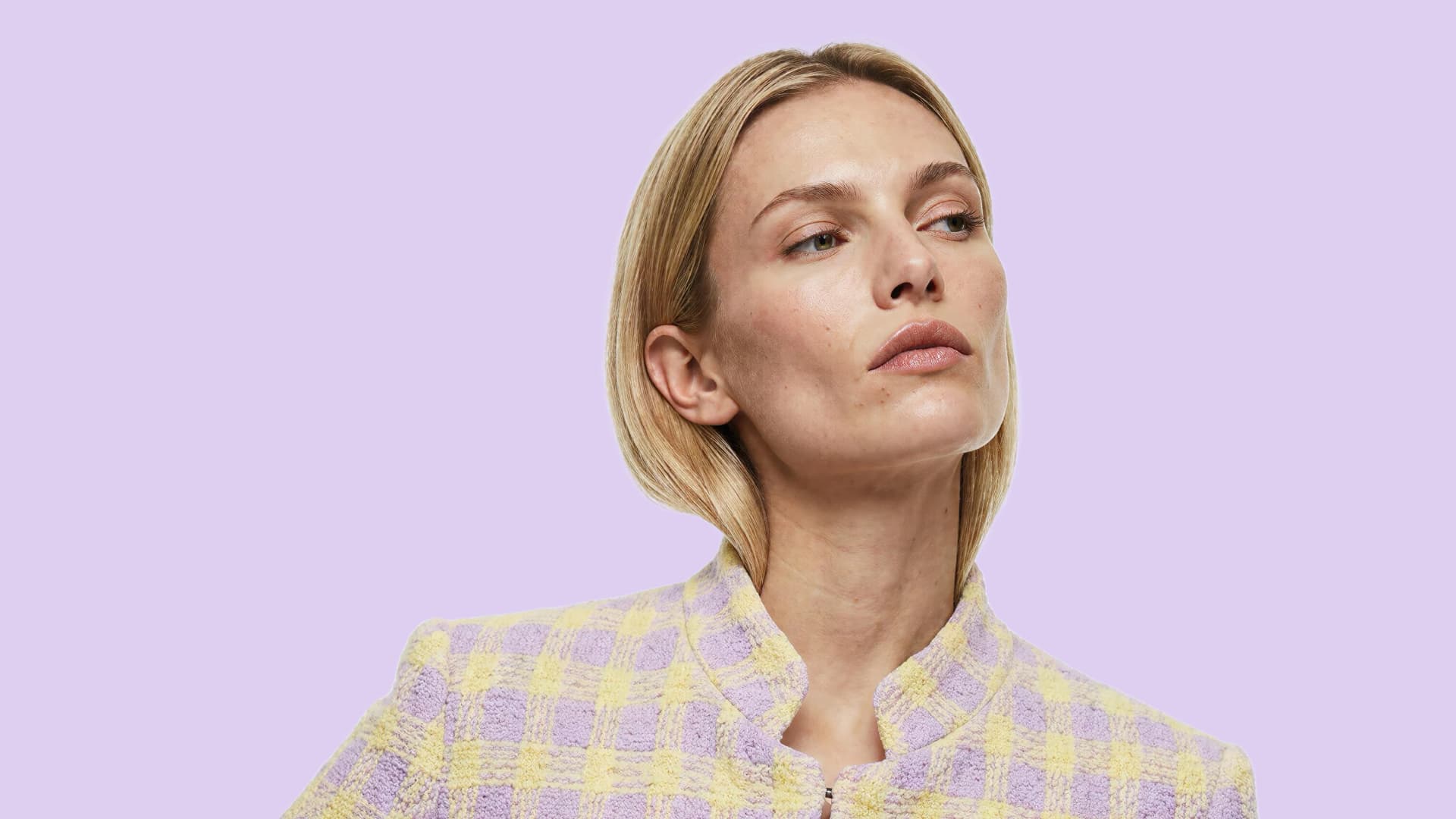 A model in a lilac and butter tweed jacket — the AI Fashion Brand Manager, for brands that sell what they create