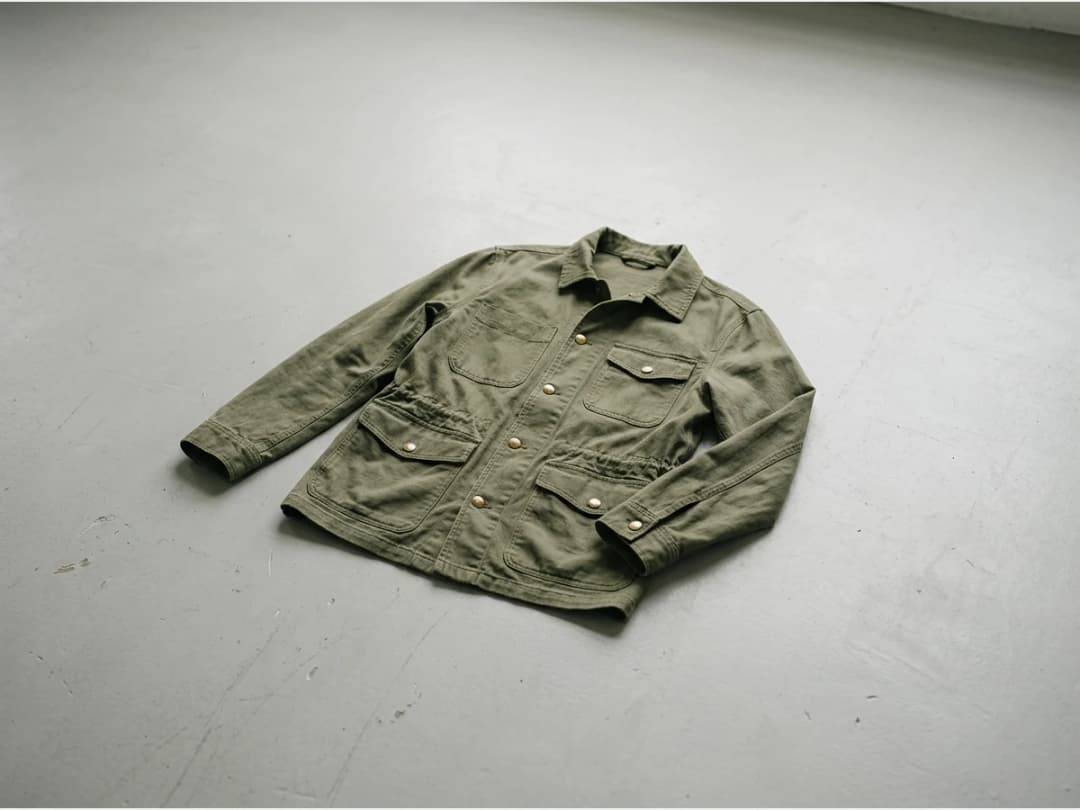a clean fashion product shot with the background emptied, a jacket alone on a plain ground
