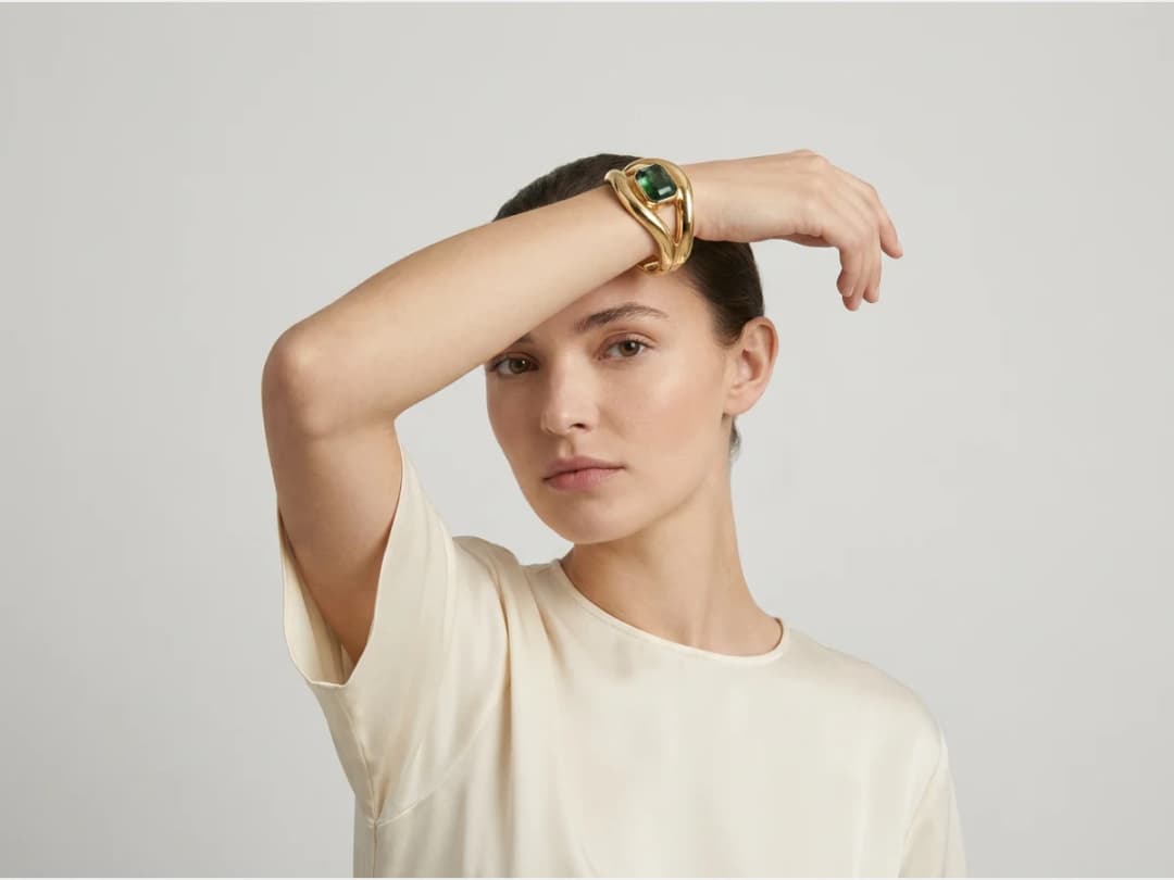 a model photographed to show a piece of jewelry, a bracelet on the wrist