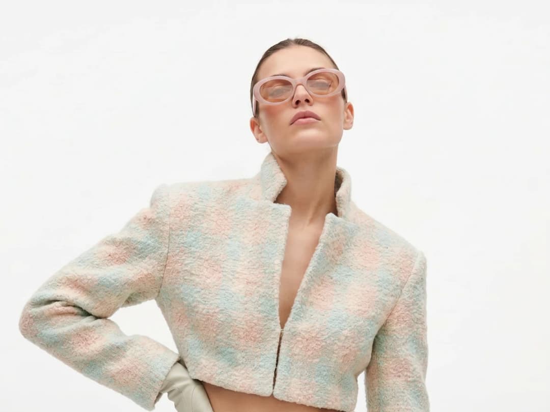 A model photographed still, the single frame the video is animated from