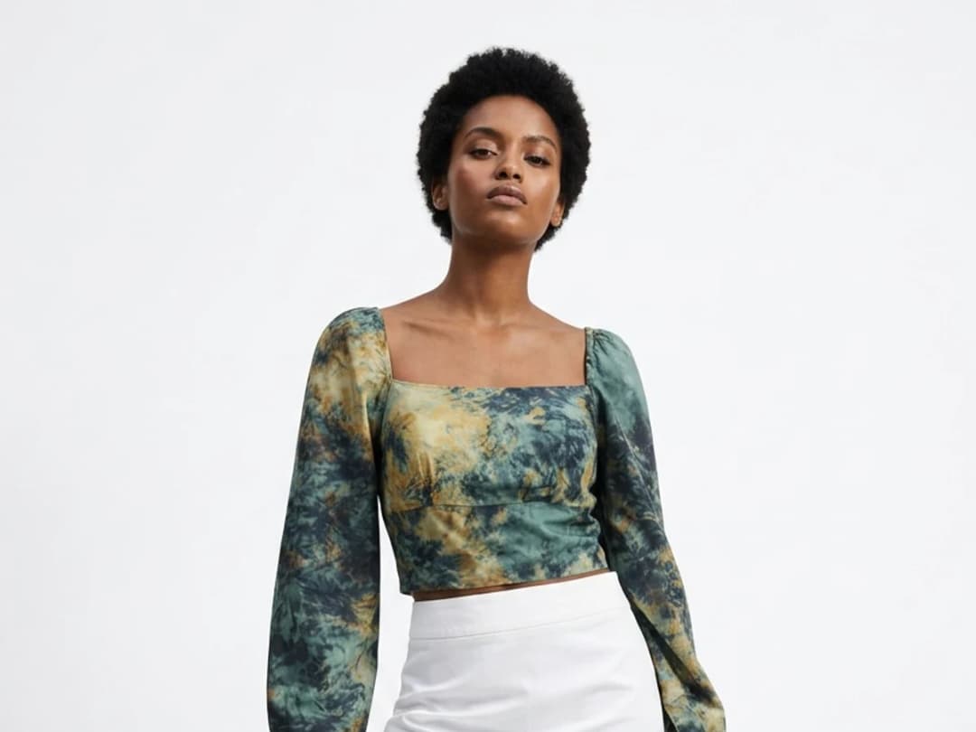 An AI model wearing the same top, generated from that single photograph