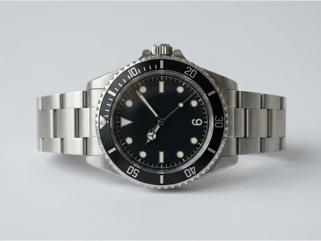a wristwatch, product shot, a steel diver watch, face on