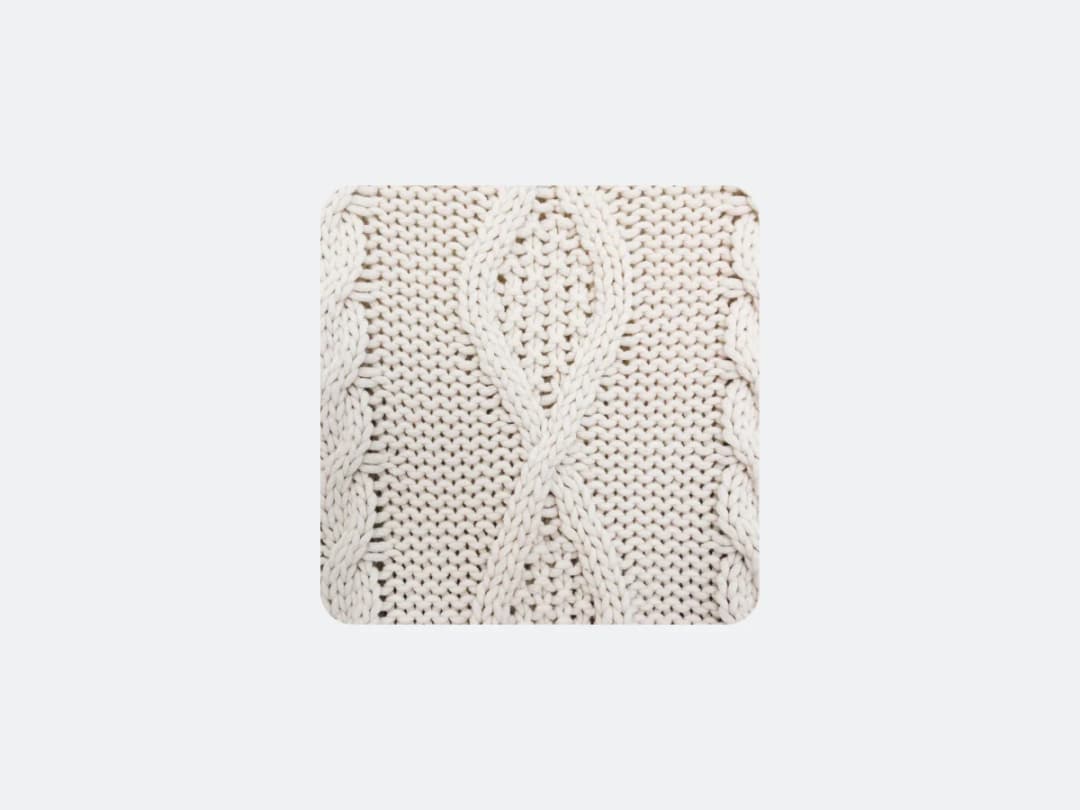 The cable knit chosen to replace it, uploaded beside the photograph
