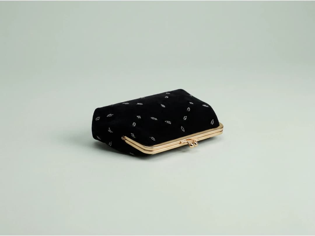 a designer handbag, product shot, a small evening clutch