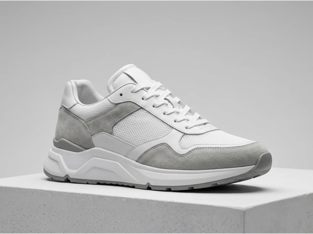 a designer shoe, product shot, a running sneaker in white and grey